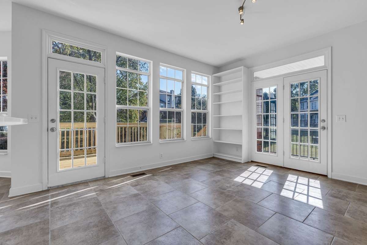 Florida Room is part of the Kitchen with doors to the deck (left) and covered porch (right).