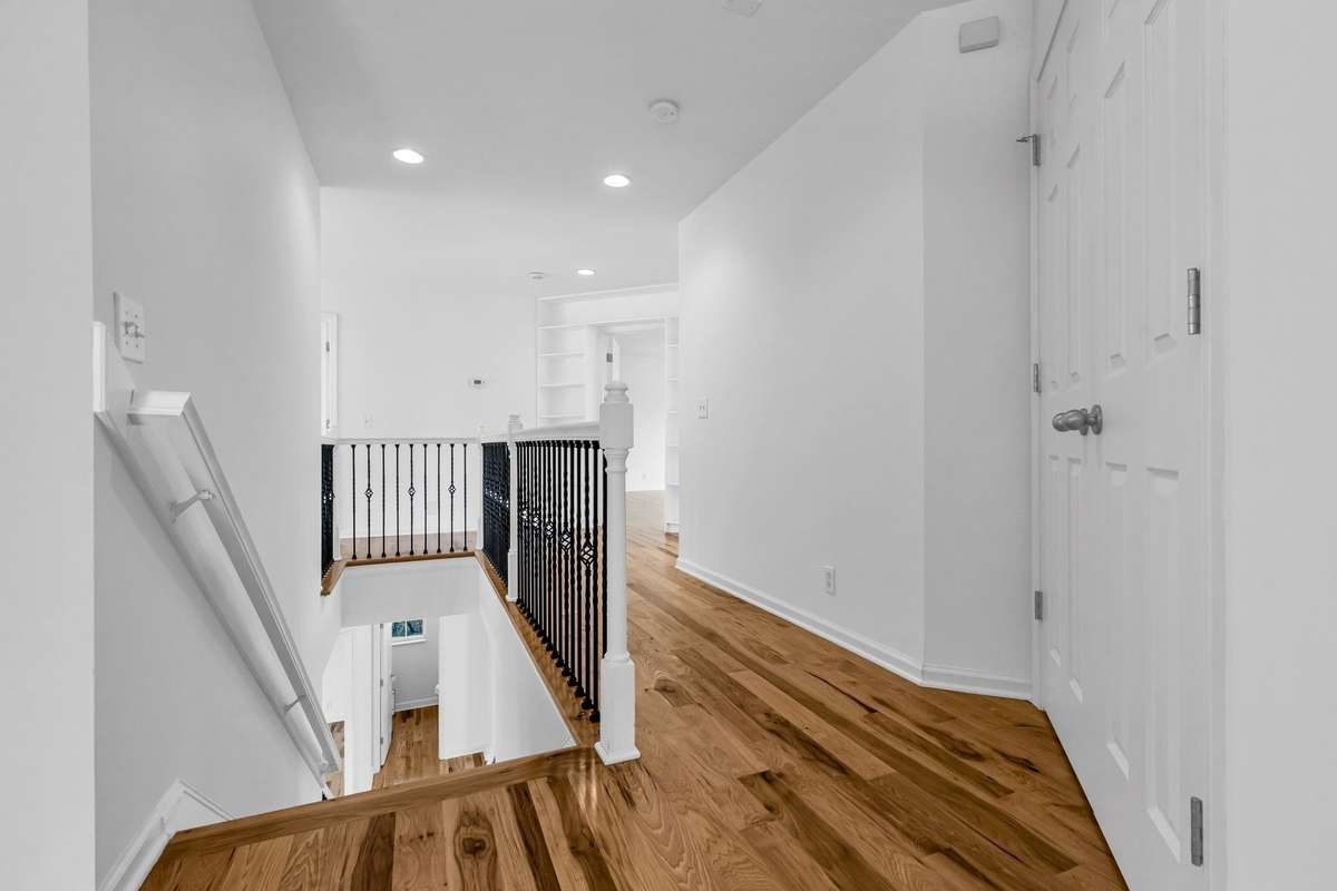 Upstairs hall has a large linen closet and attic access.