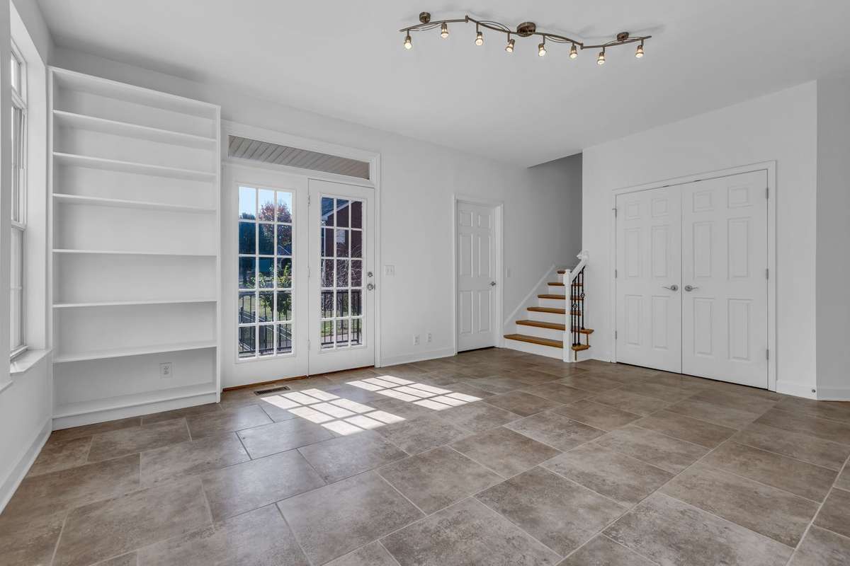 Kitchen/Florida Room has built-in shelves ready for books, cookware, and more.