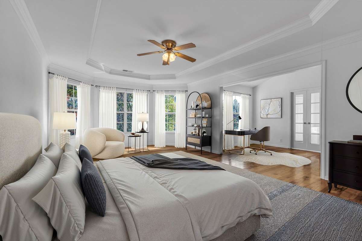 Space for bed, seating area, and office in the Master Bedroom Suite (virtually staged)