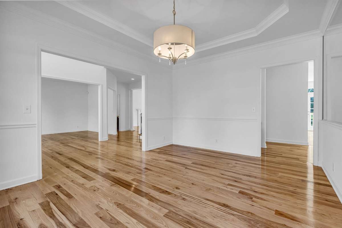 Open Dining Room with tray ceiling