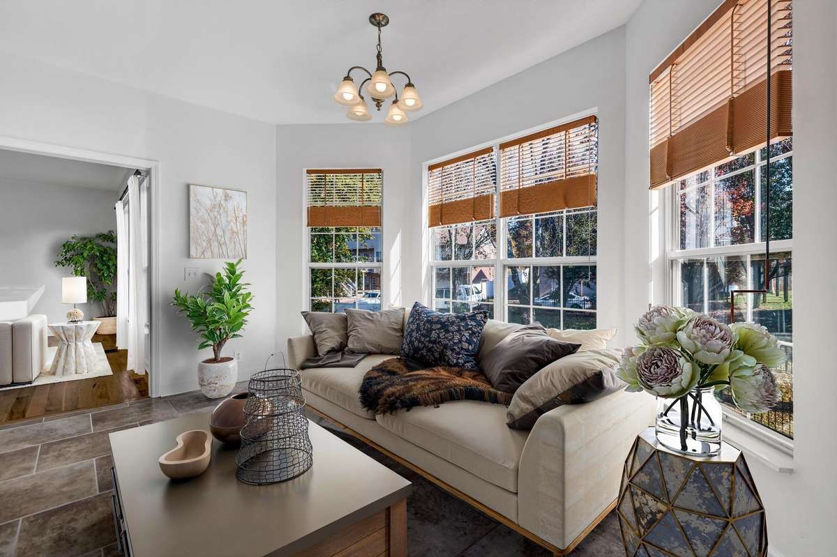 Here is one way to use this bay window space in the kitchen (virtually staged)
