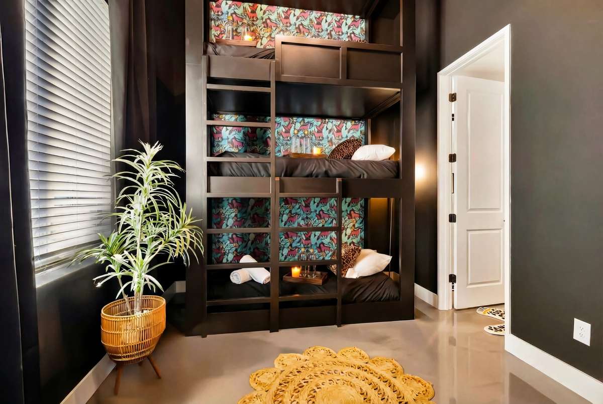 The final bedroom is located on the ground floor. It features gorgeous polished cement floors!