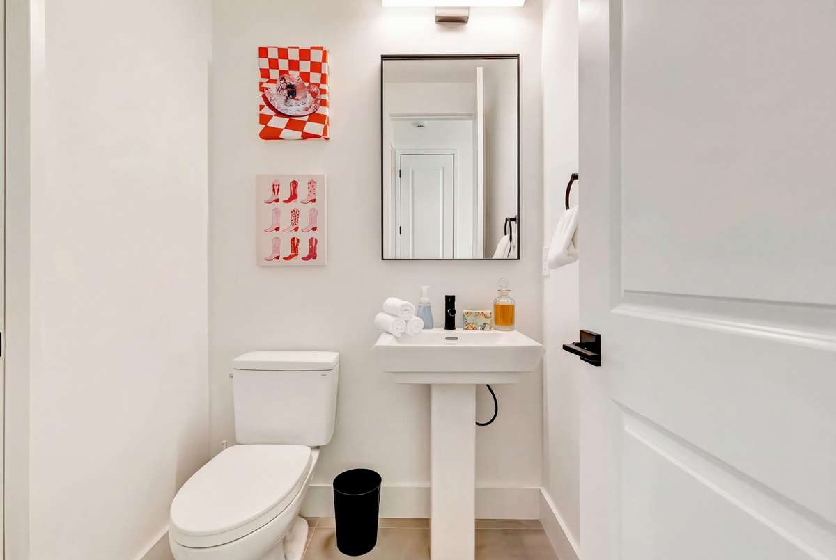 The attached full bath is also accessible from the main floor hallway, making it perfect for guests!