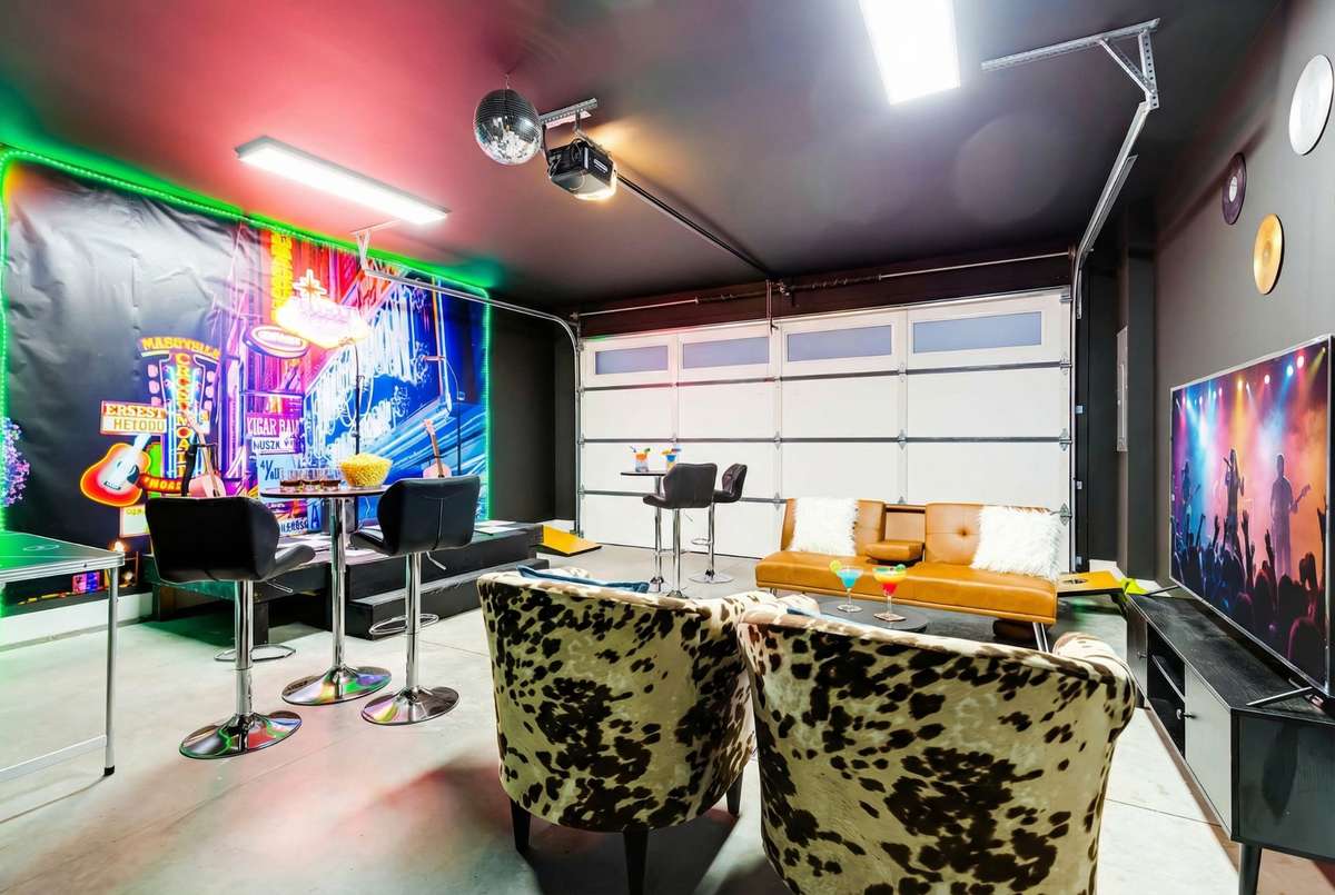 This space is now an amazing bonus room/karaoke bar that is sure to delight renters!