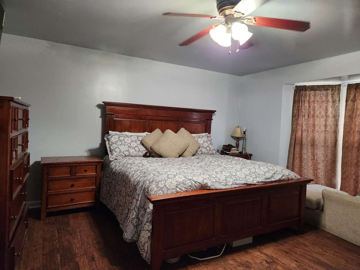 Freshly painted master bedroom that accommodates king sized furniture!