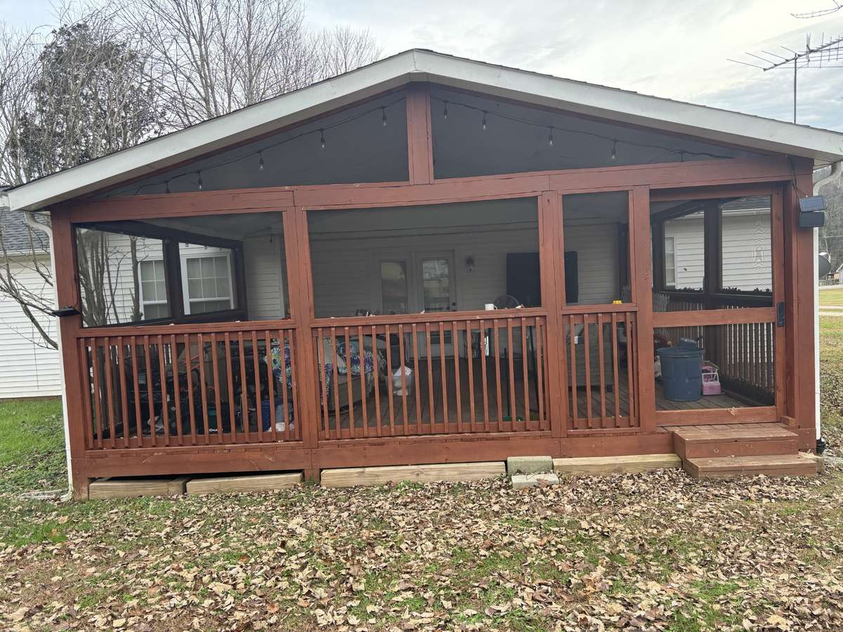 Enjoy the feel of the outdoors in the cozy screened porch!