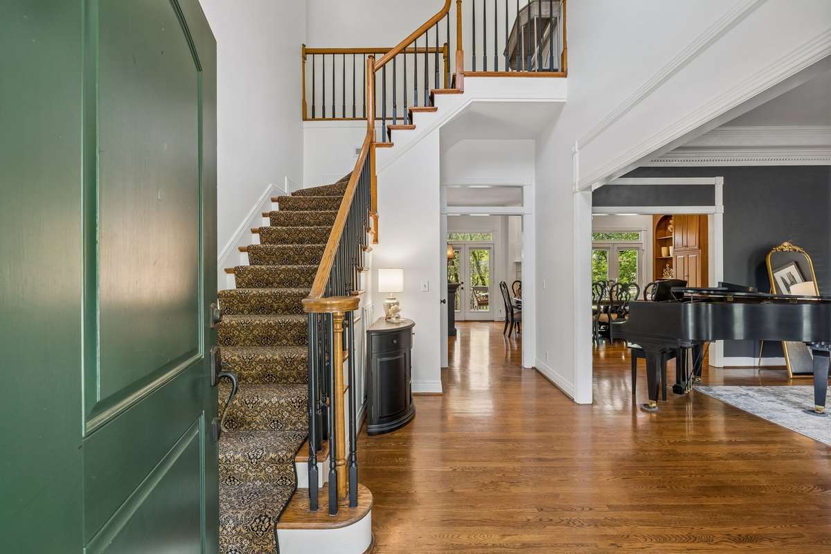 Step inside to a bright and inviting two story foyer.  Sleek hardwood flooring and rich elegant moldings offer quality enhancements to this well constructed residence.