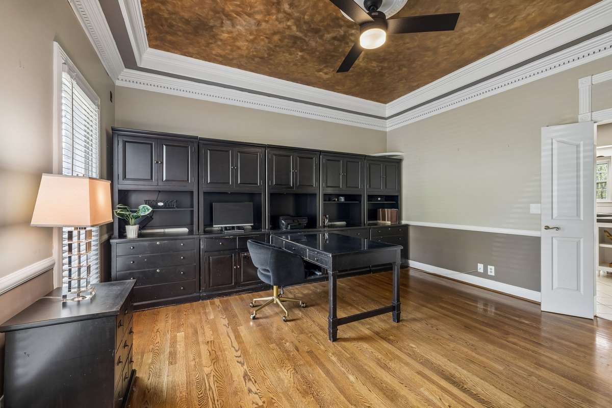 This office space connects to the kitchen and overlooks the front lawn.