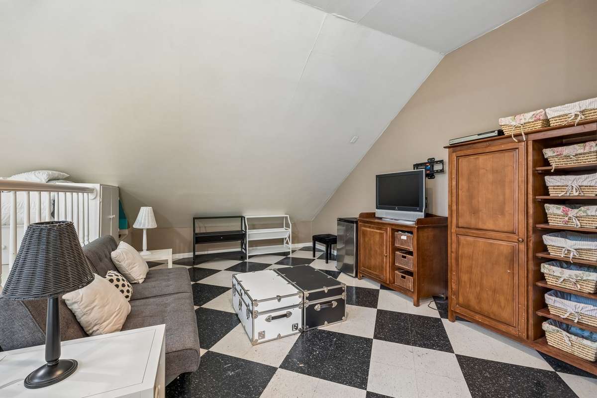 There is a space on the "lower level" of this room for gathering or enjoying a family movie night.