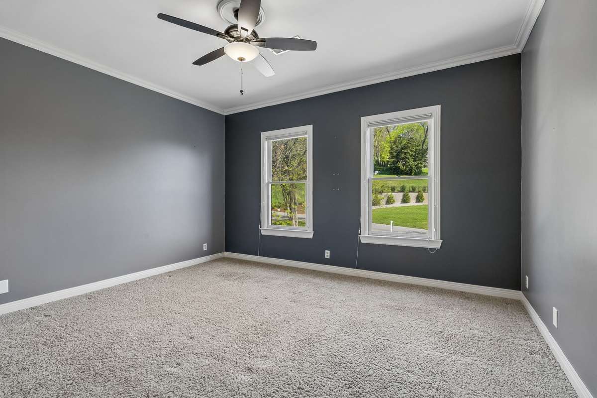 This is the other front bedroom, closest to the back staircase and playroom.