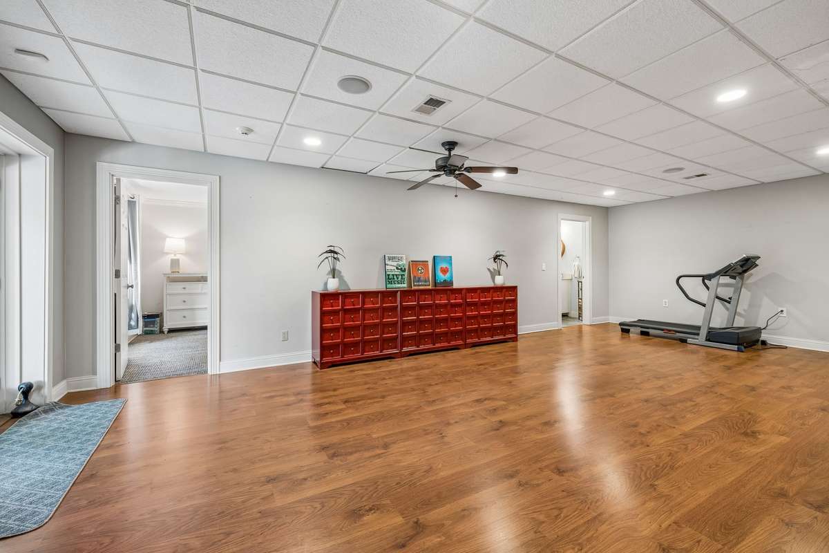 This expansive area could accommodate a ping pong or game table, room for exercise equipment and more!