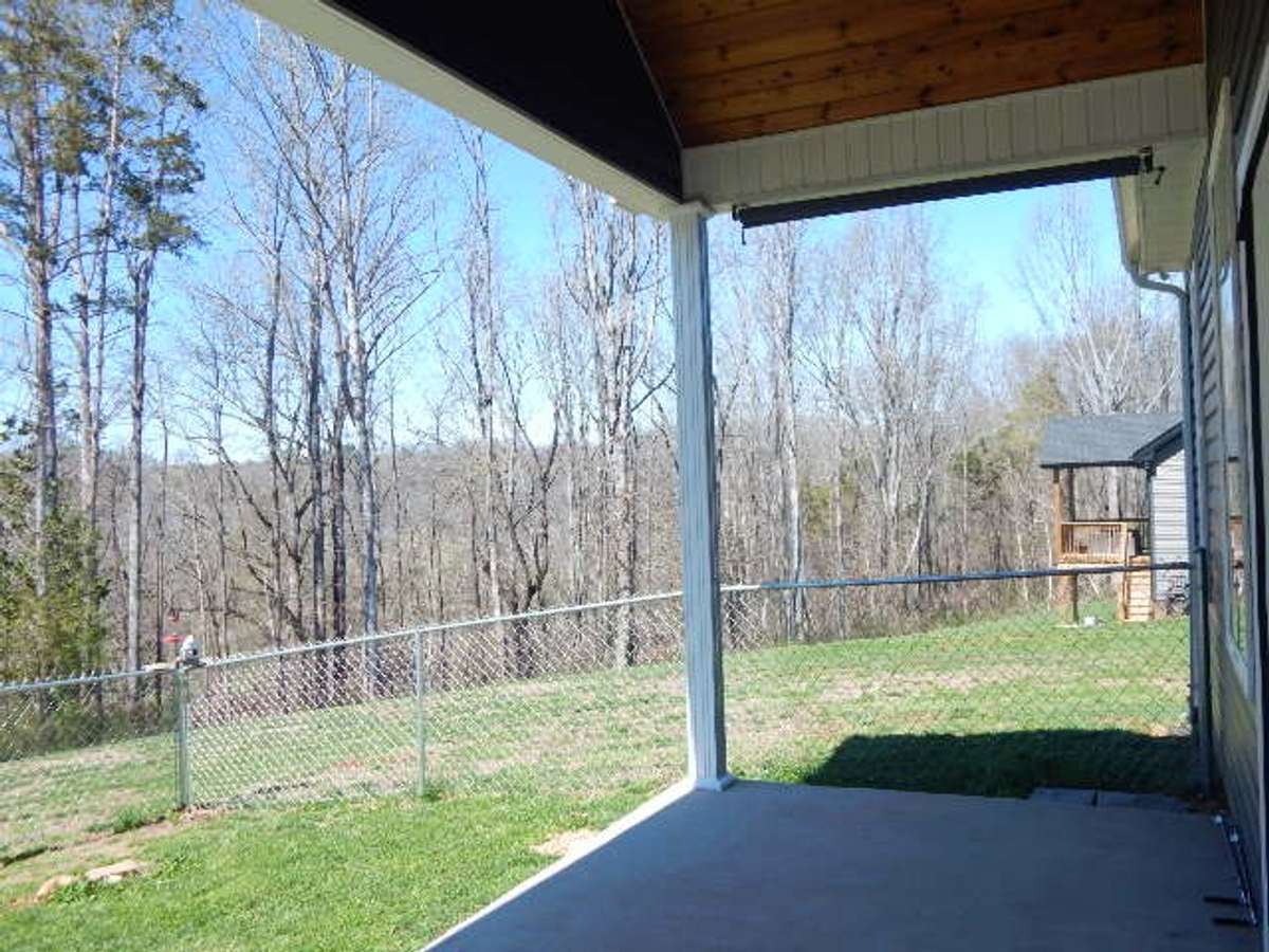 The rear of lot is wooded. No neighbors to see!