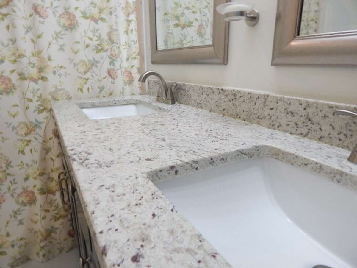 Granite countertops on his and hers sink