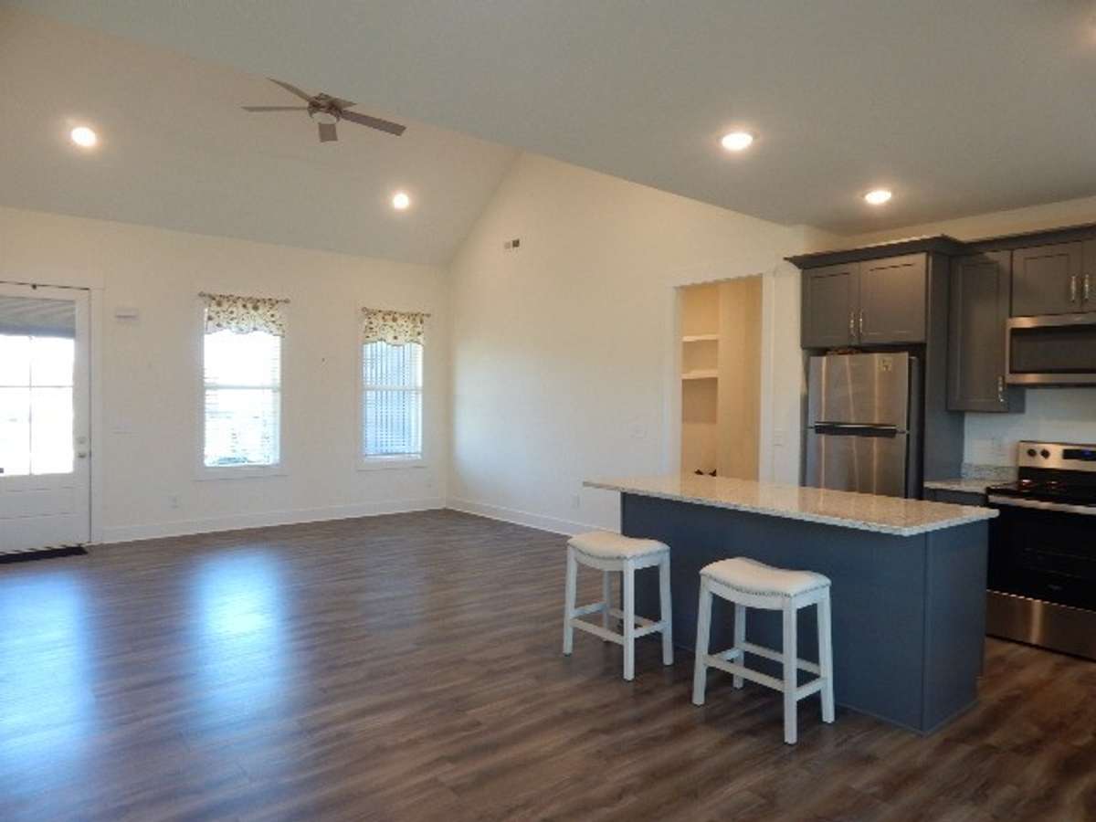 This home has an open concept layout .The Great room/dining area and kitchen area measures 28 x 19. LVP flooring and granite countertops. Many recessed lights.
