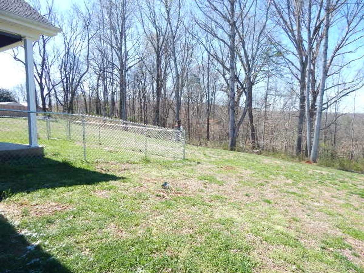 Fenced in area off the back porch for your convenience, pets, or kiddos.