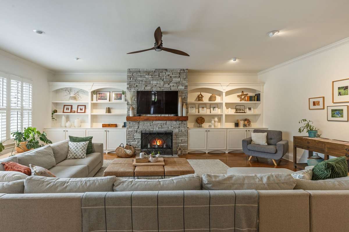 HUGE Family Room with stack-stone fireplace and built-ins