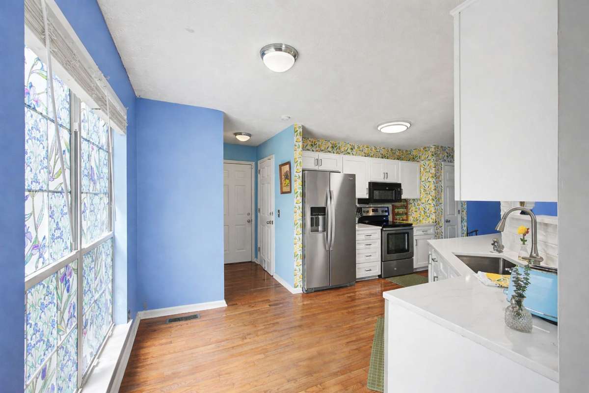 The laundry room is off the kitchen and the door to the large 2-car garage.