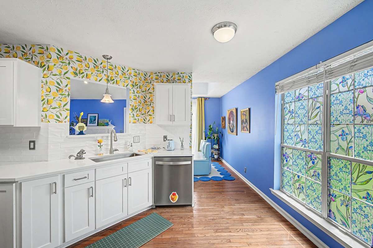 The kitchen was renovated just a couple of years ago and has sleek cabinets, quartz counters and shiny subway tile backsplash.