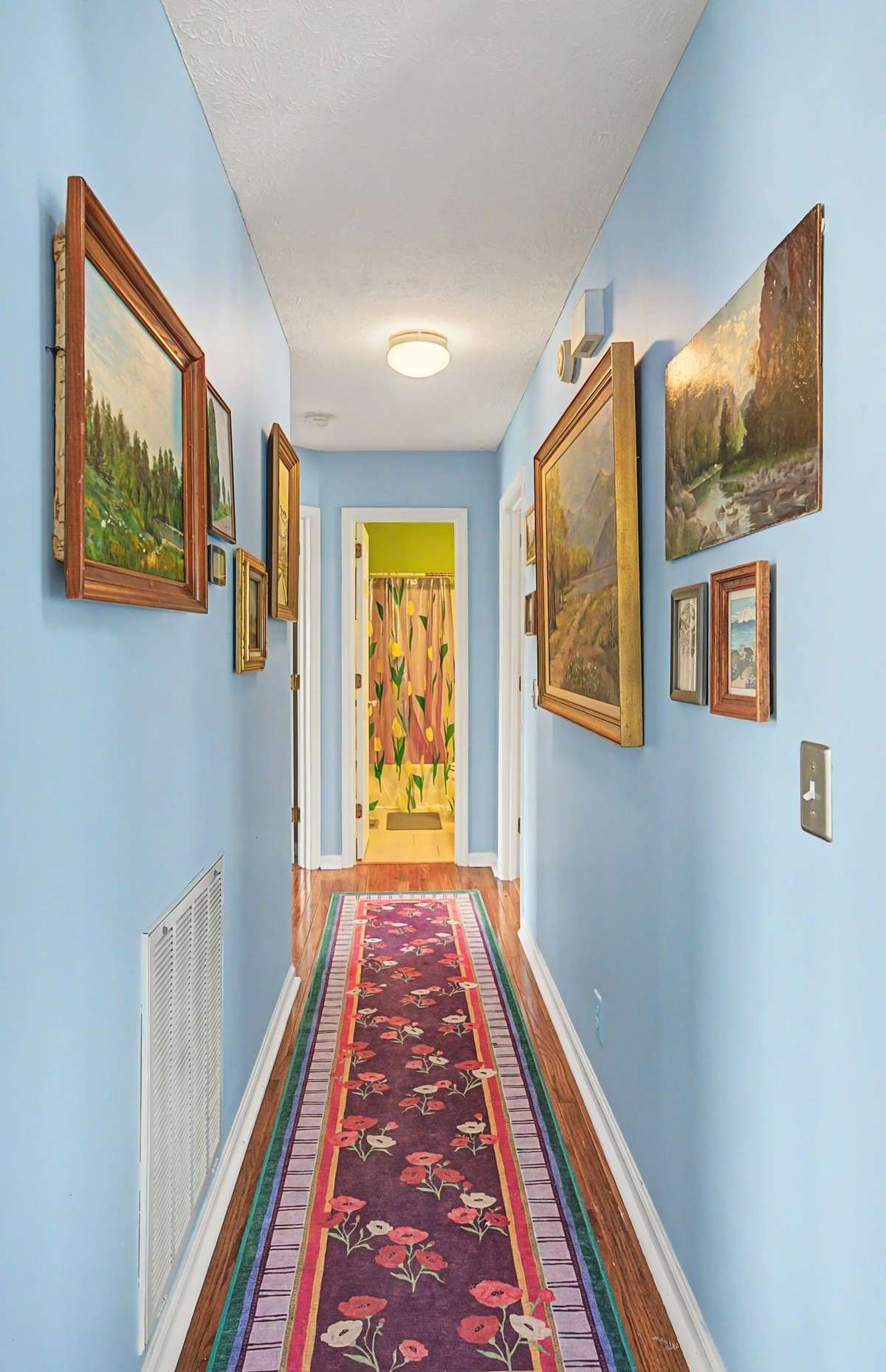 View of the hallway to the secondary bath.