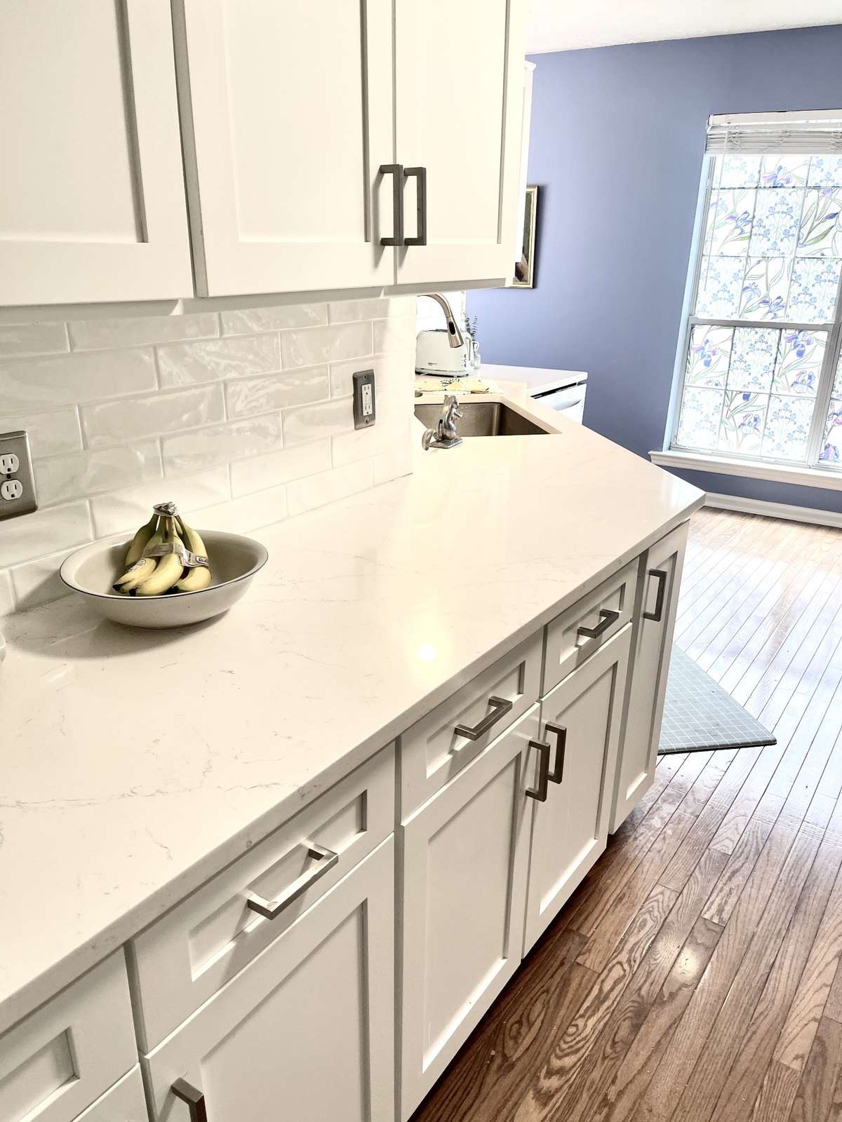 Here is a close up of the quartz countertop and tile backsplash.