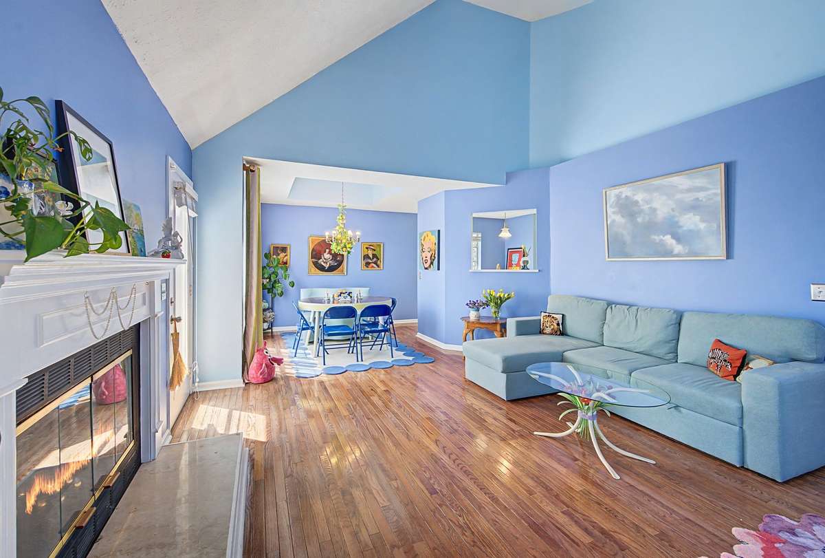 The living room opens to the dining room and there is a door to the deck.