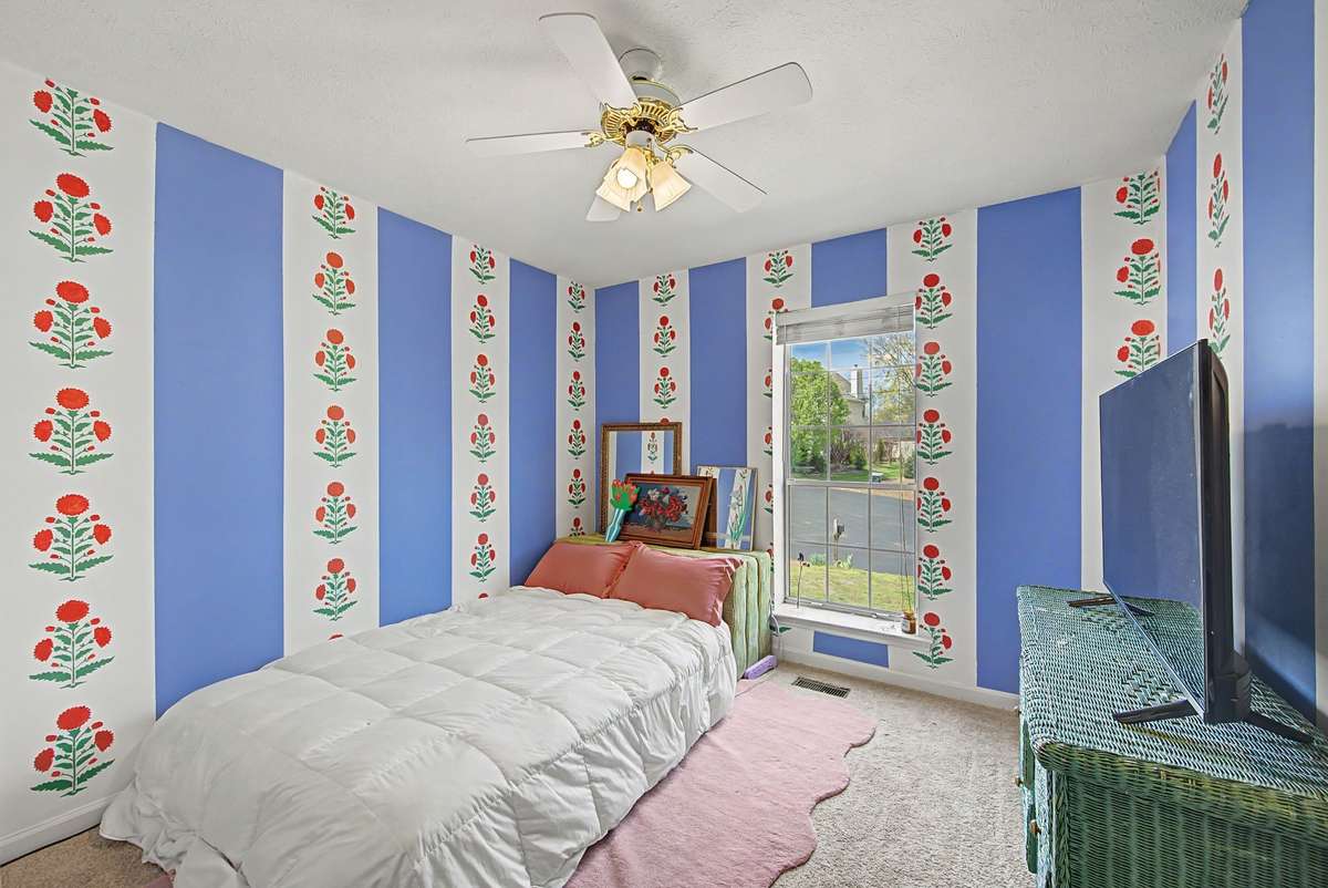 Bedroom 3 has fun designer wallpaper and a large closet.