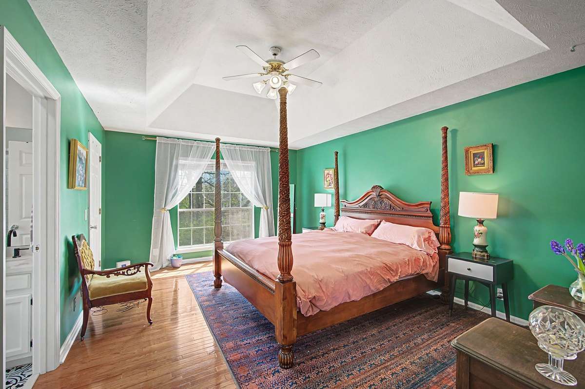 Wow!  What a large primary bedroom with vaulted ceiling and hardwood floors.