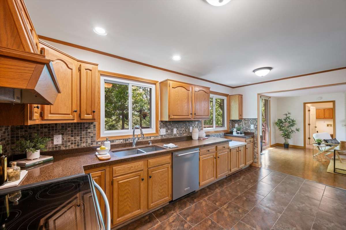 Spacious kitchen with lots of natural lighting throughout.