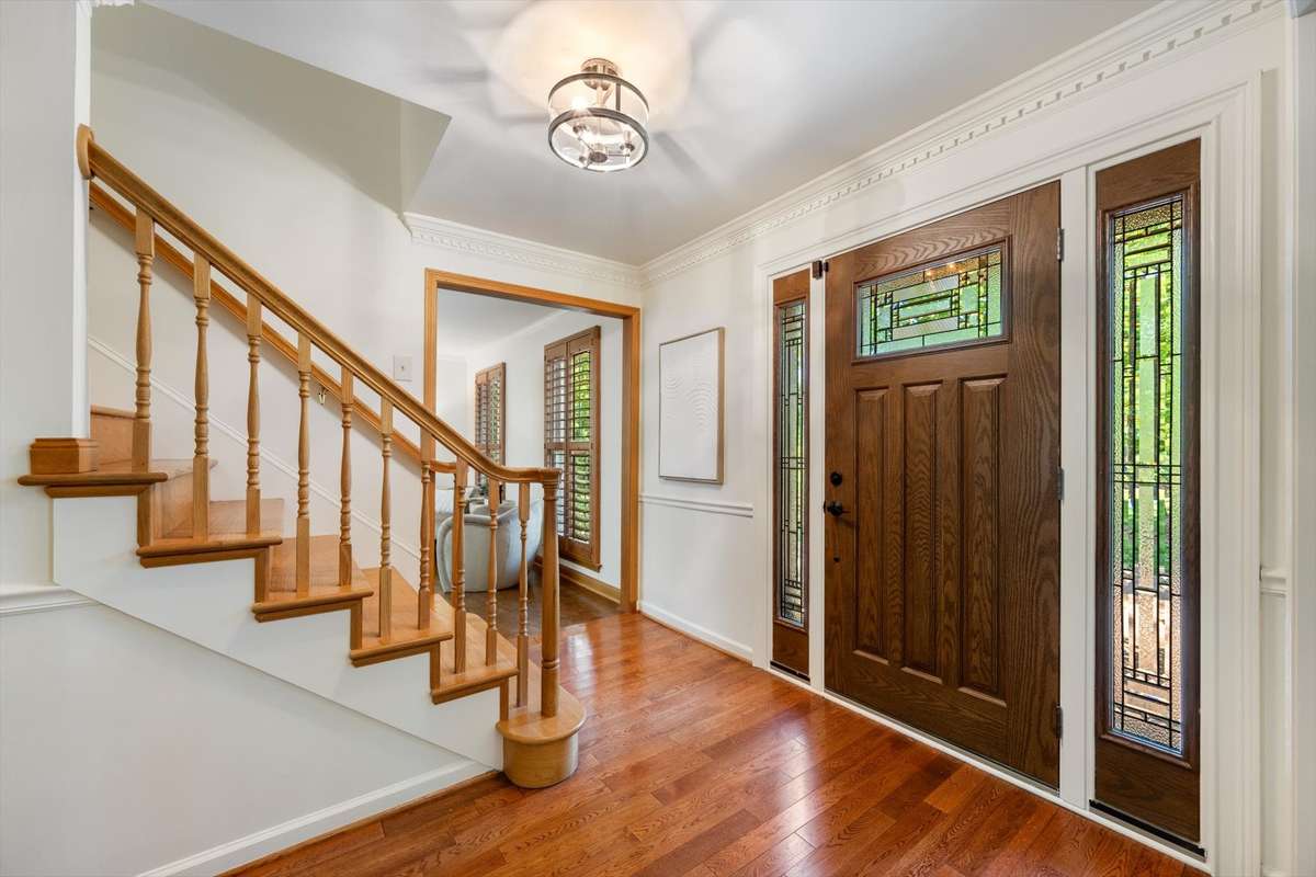Hardwood floors on the main level and stairs. Gorgeous front door and etched glass panels.