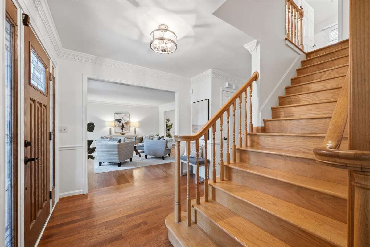 Entry foyer has breathing room and separates the living room from the cozy den