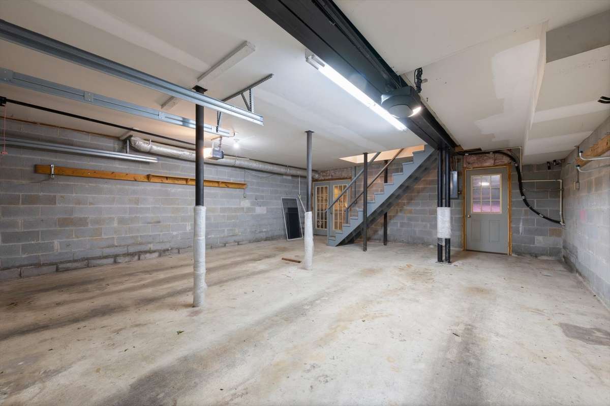 Two doors from the garage lead into the crawlspace area.