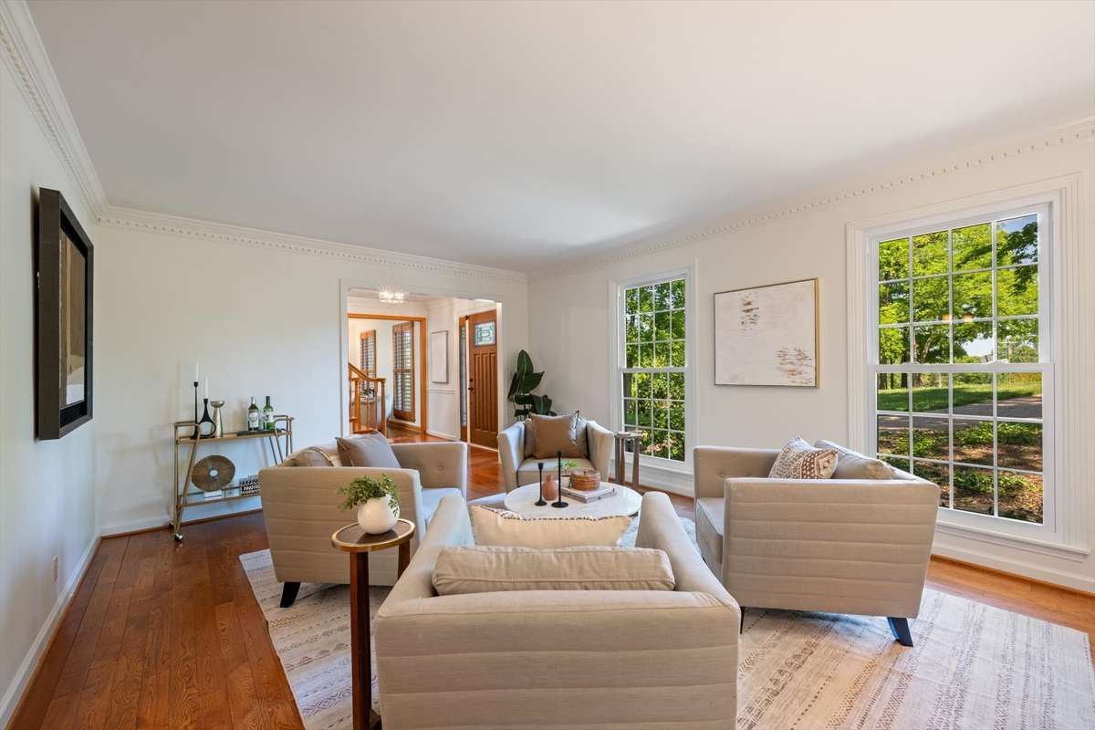 Spacious living room just off the entry foyer and connects to the dining room