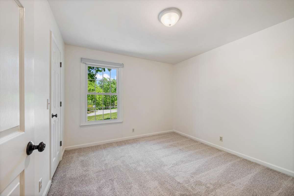 Secondary Bedroom facing the front. Walk in closet here.