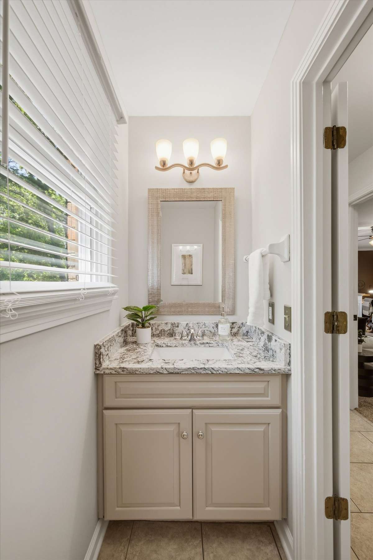 This half bath serves is on the main level nearest to the den, bonus room and laundry room.