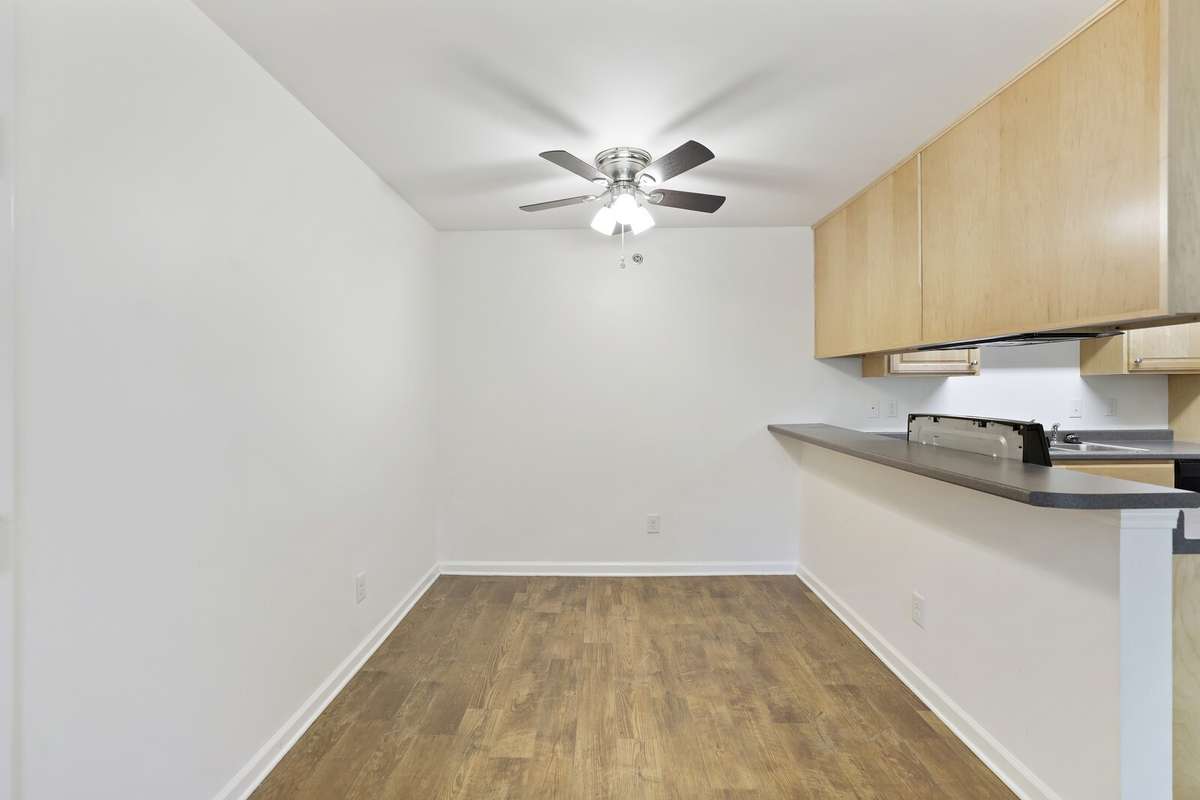 Spacious Dining Room with a bar overlooking the kitchen. Plenty of room for entertaining
