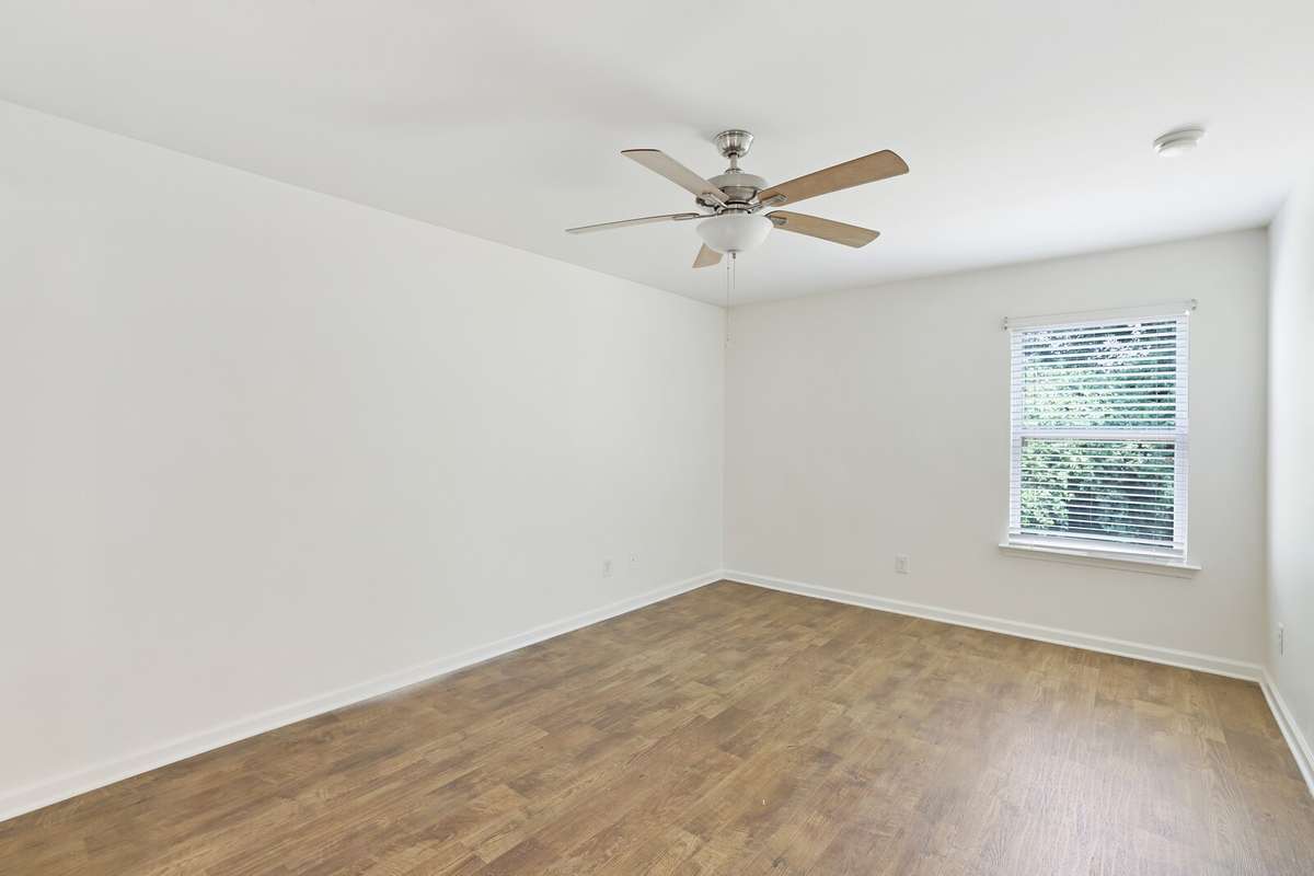 The huge primary bedroom is a true retreat, offering plenty of space to unwind