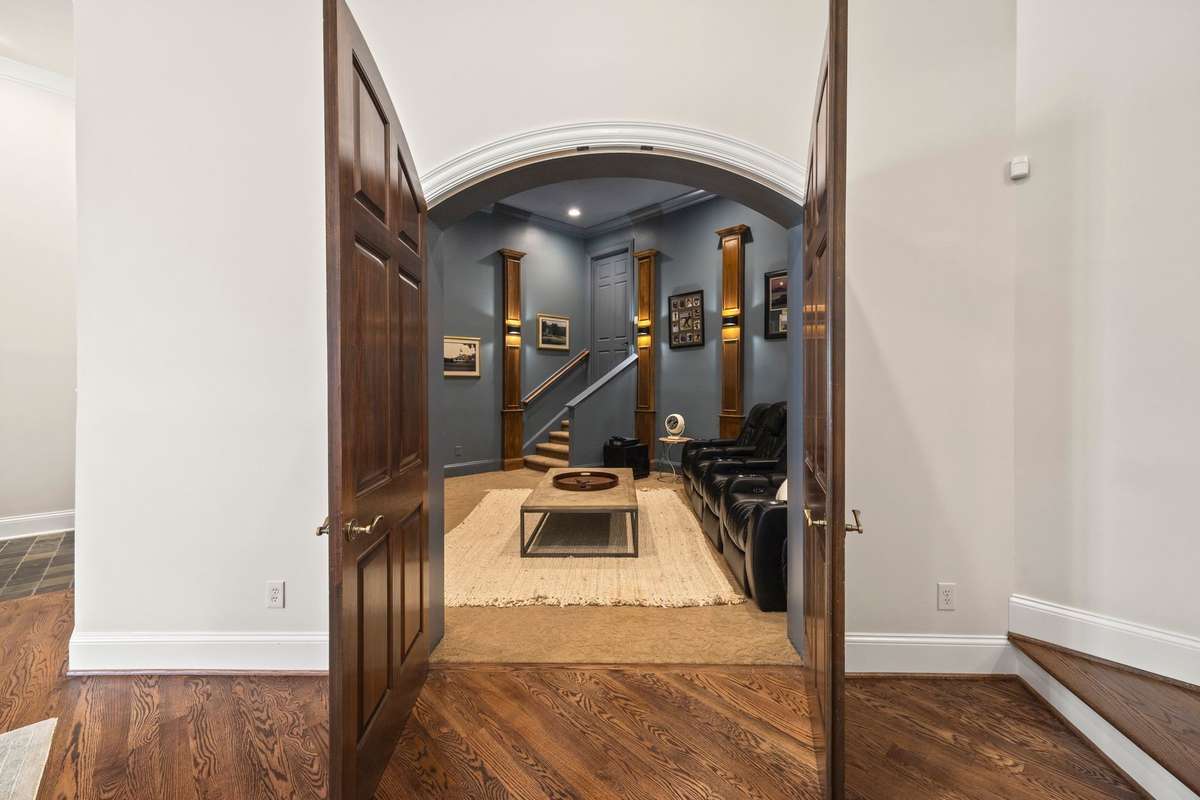 Private theater room with new projector and wall sconces.