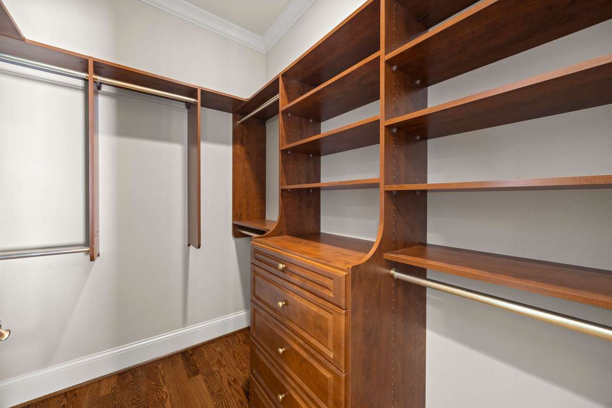 One of two custom closets for the Primary Bedroom.