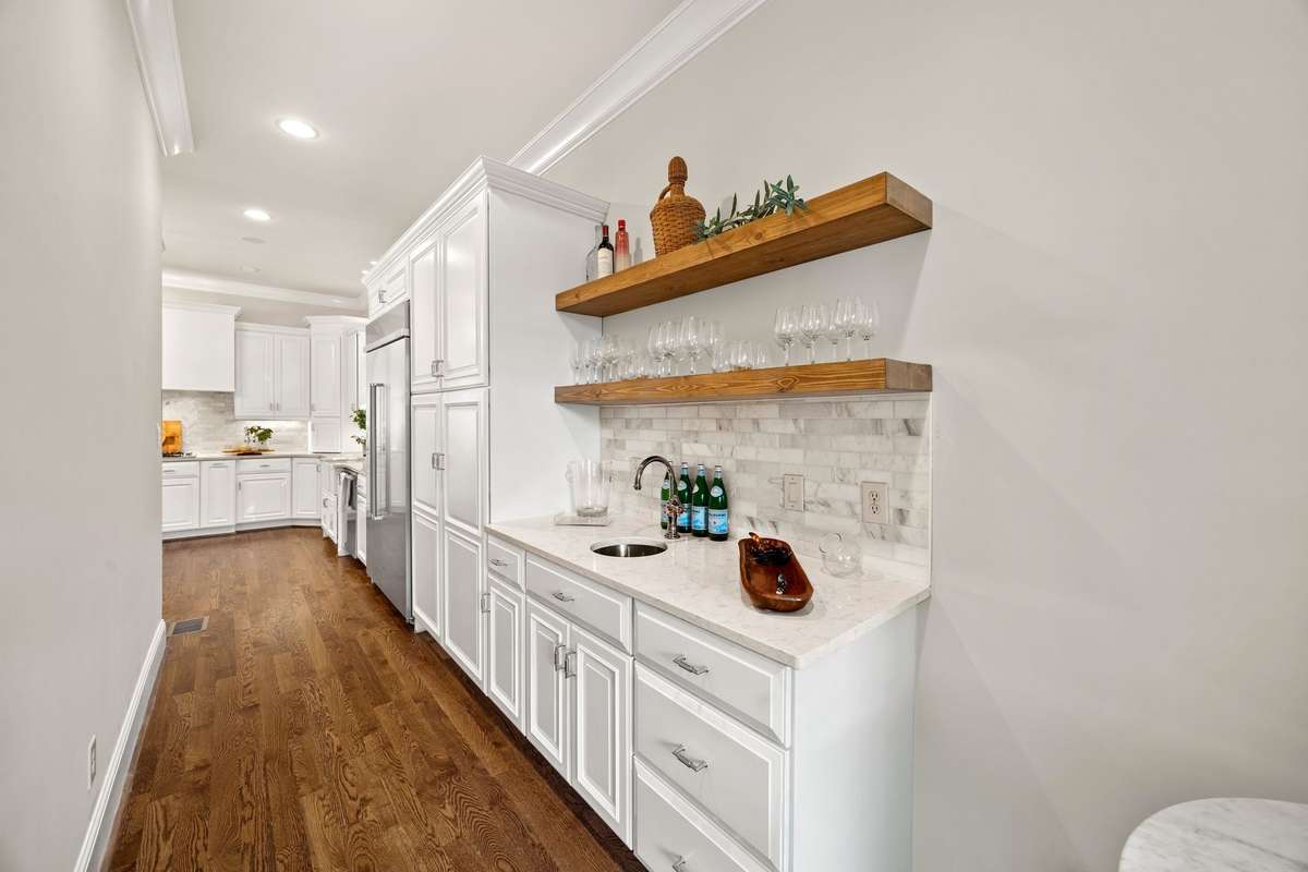 Private area off Kitchen with Wood Shelves and Prep Sink.