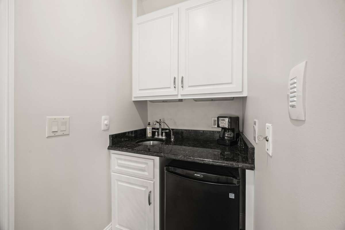 Wet Bar beside screened balcony.