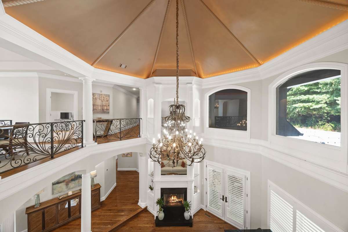 Chandelier will retract up and down for easy cleaning and bulb changes.