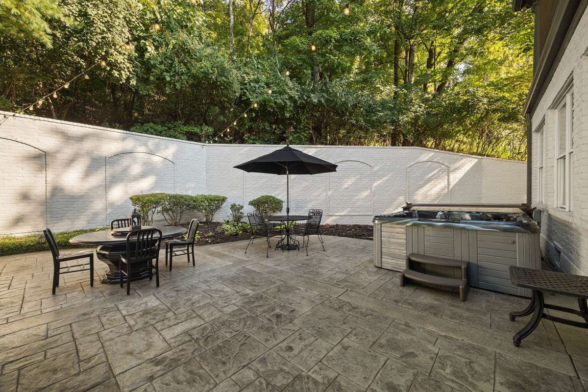 Hot tub convenes with home.