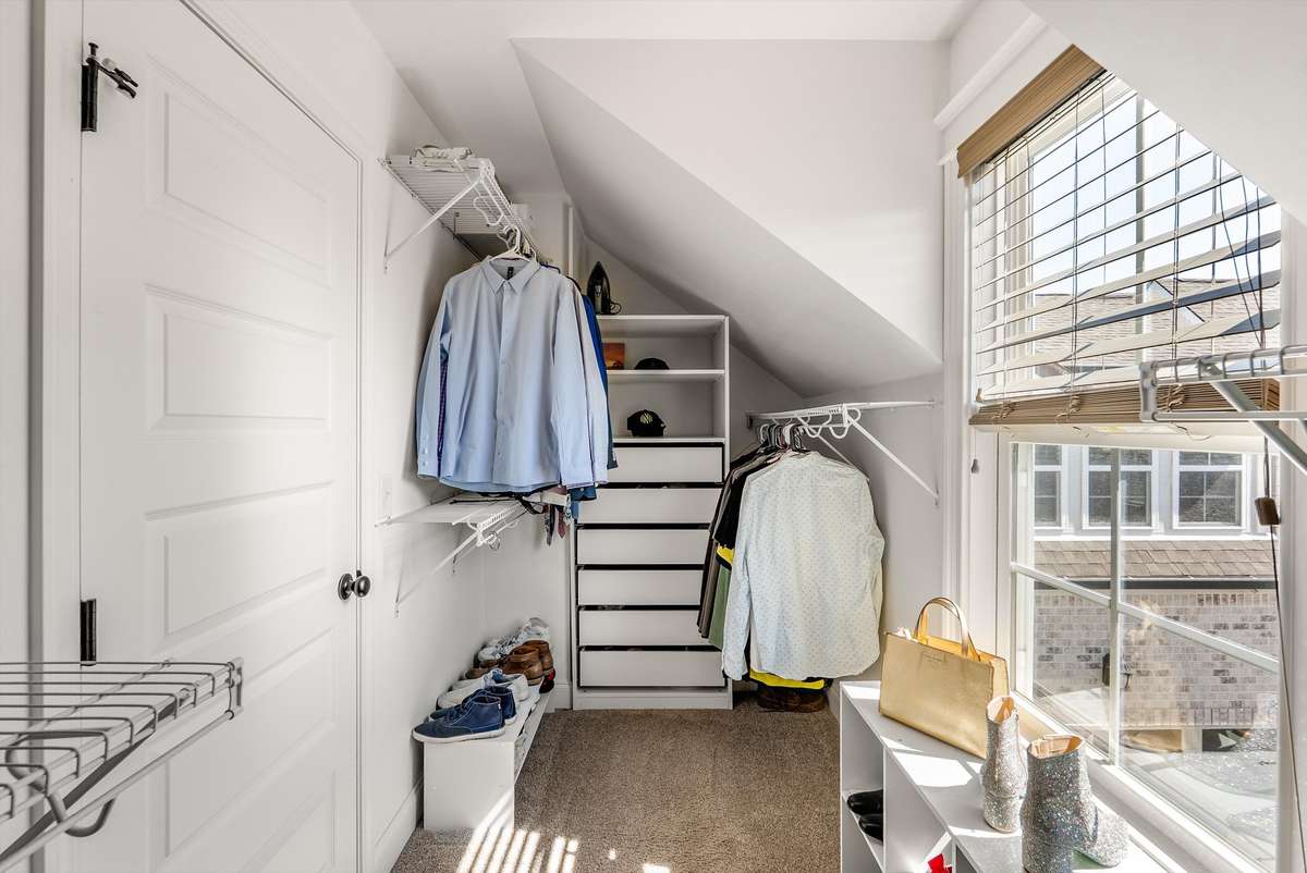 Primary closet with a lot of natural light and space to get ready each morning