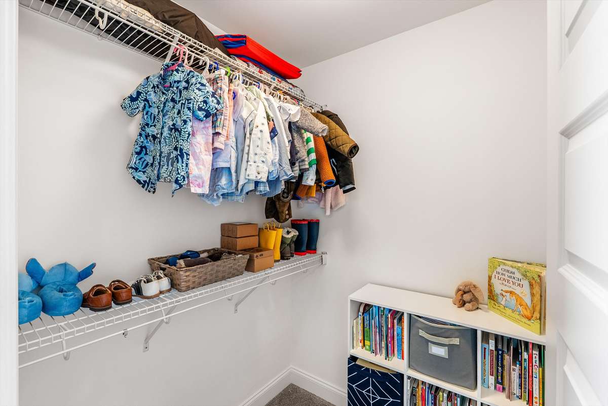 Walk-in closet inside the secondary bedroom
