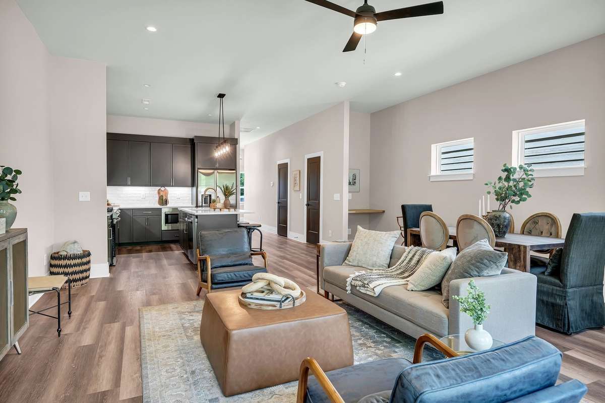 Open Kitchen, Living and Dining Area with Custom Desk Top/Bar area with Lots of Natural Light.