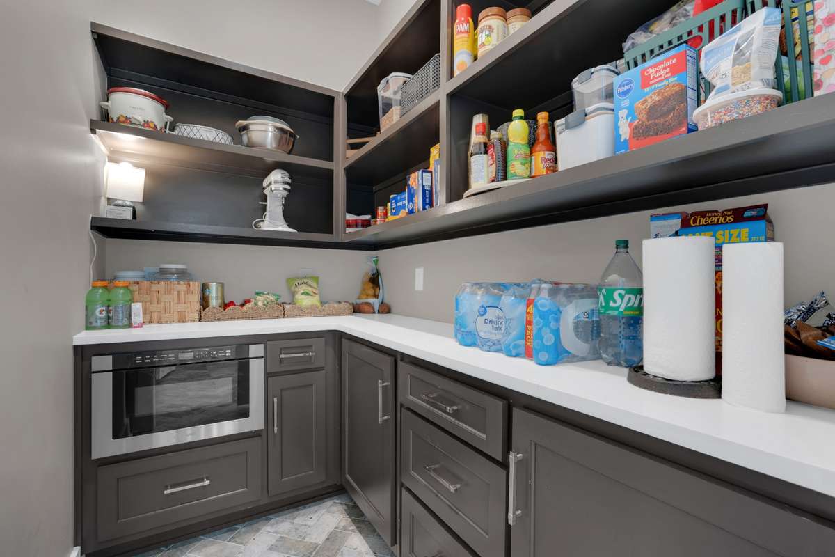 Butler's Pantry with tons of storage and microwave.