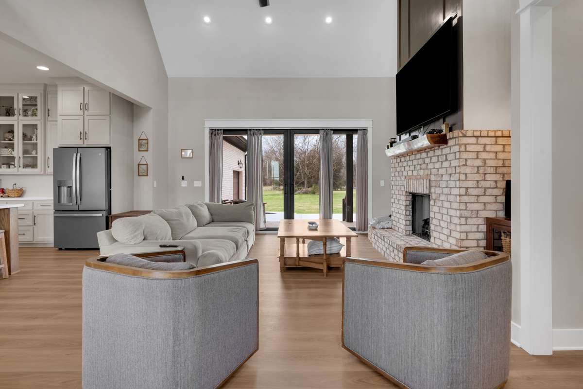 Vaulted ceiling in the great room with lots of recessed lighting and amazing floor plan