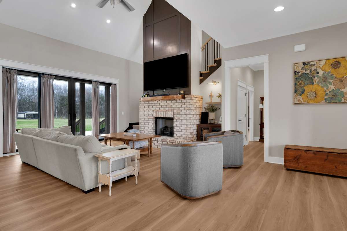 Great room with brick fireplace and beautiful wood accents
Flooring is upgraded LVP