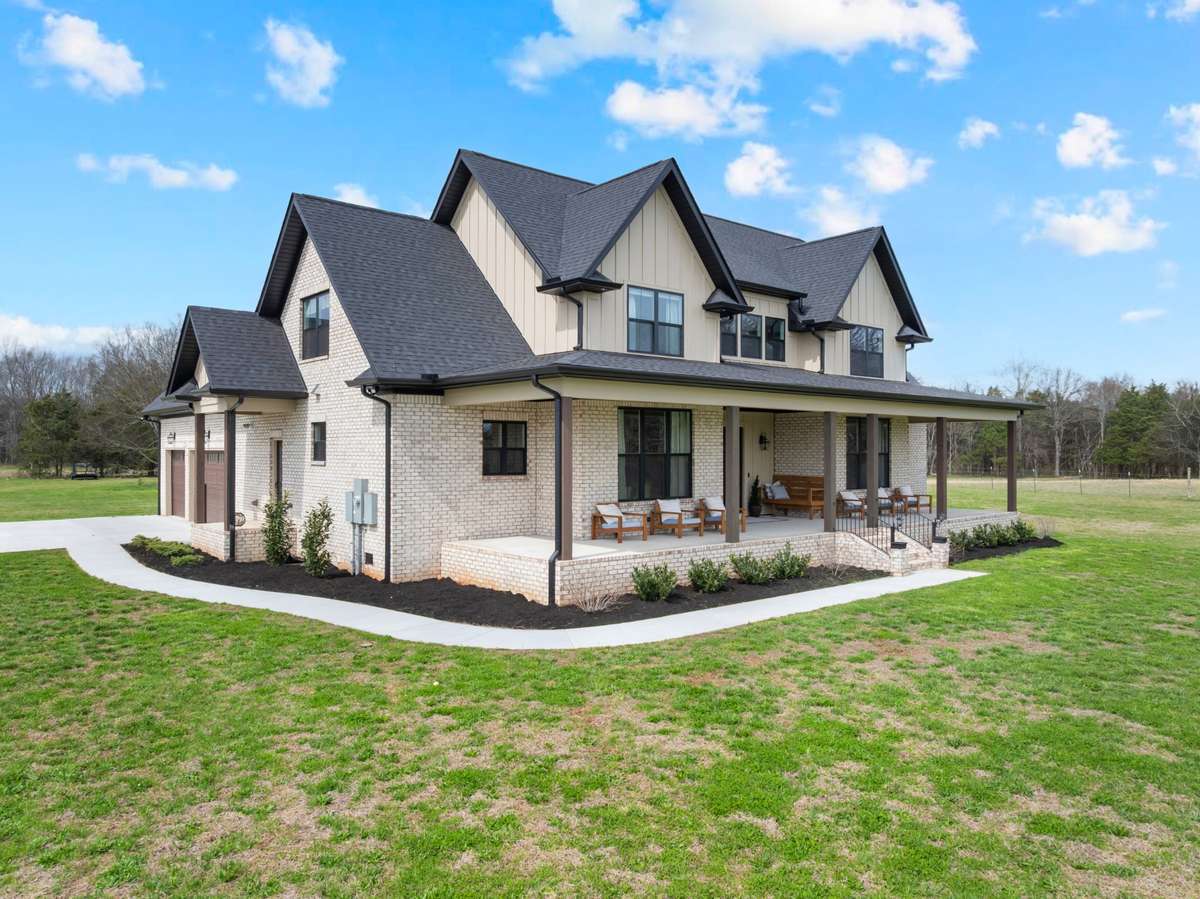 Side view of home and acreage
Front and Back porches are oversized
3 Car Garage
